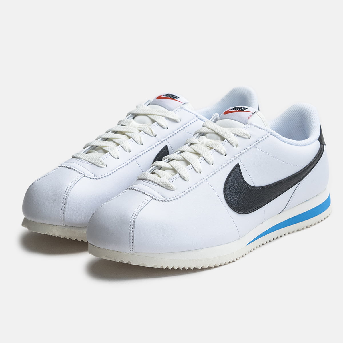 Nike cortez blue and white on sale